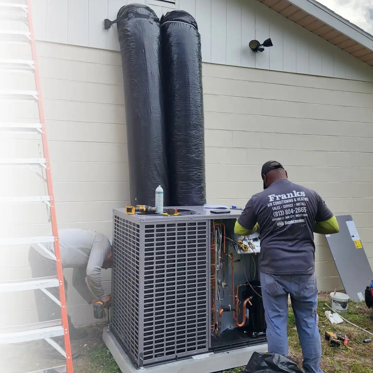 Franks technician's completed condenser replacement at a Zephyrhills home